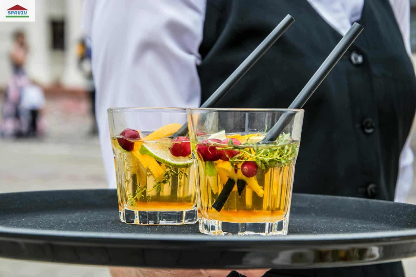 2 Whisky Glasses Filled With Beverage on Black Tray